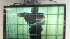 RUSSIA -- Russian opposition leader Aleksei Navalny is seen on a screen via a video link during a court hearing in Moscow, June 25, 2021